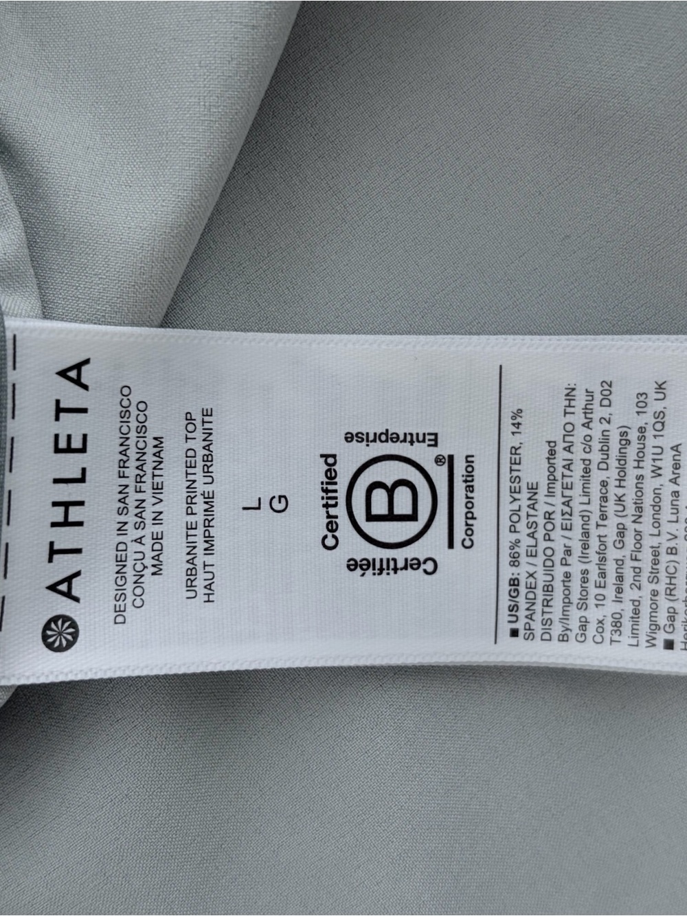 Athleta Urbanite Printed Tunic Blouse Gray Green Hidden Button Stretch Top Large - Picture 8 of 8